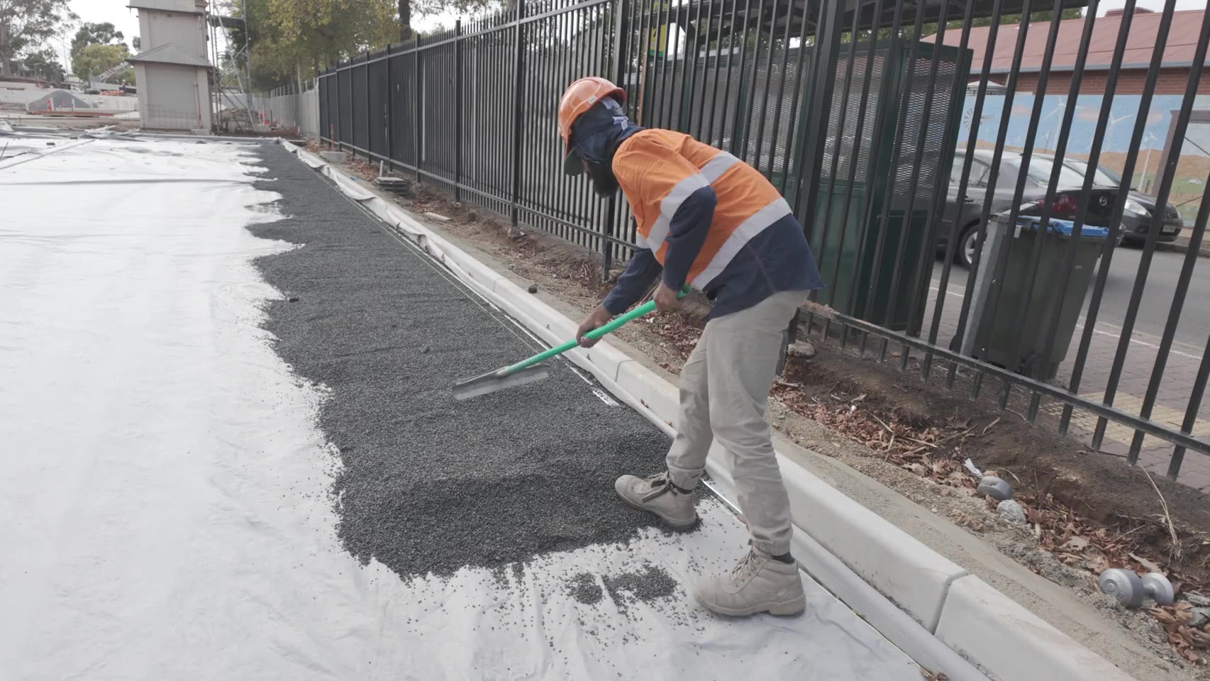 Base aggregate raked to screed — real AOI job