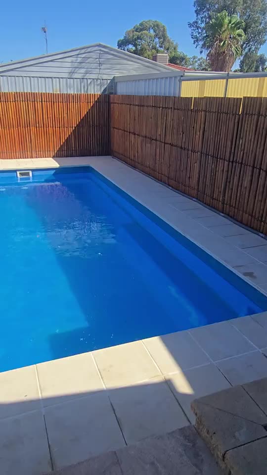 Pool surrounds, new coping — real AOI job, ambient motion simulated